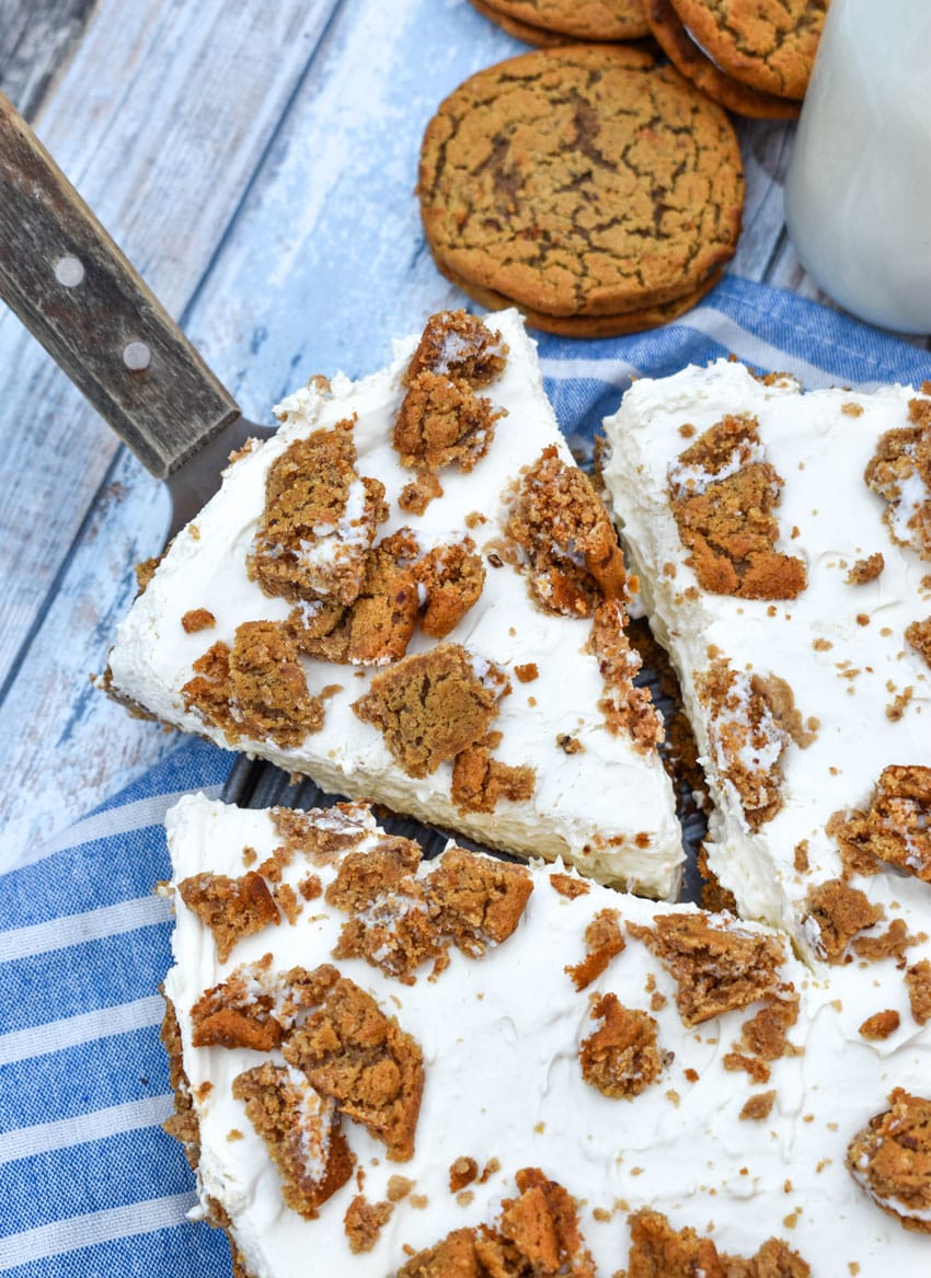 a wooden handled cake server lifting up a slice of no bake oatmeal creme pie cheesecake