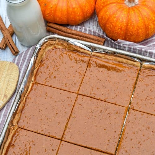 a pumpkin slab pie on a foil lined baking sheet