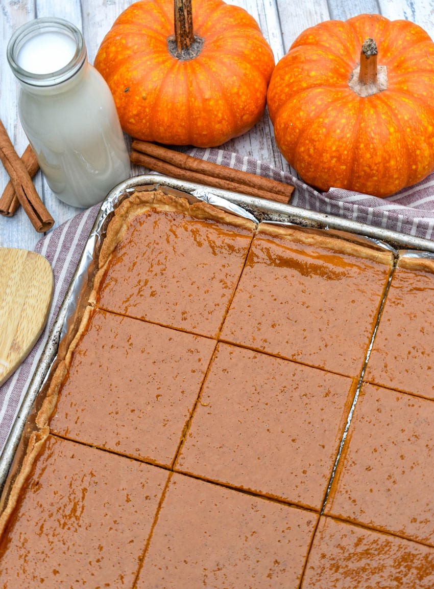 a pumpkin slab pie on a foil lined baking sheet