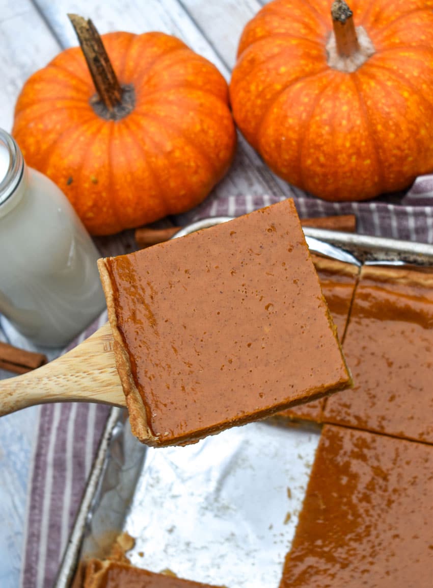 a pumpkin slab pie on a foil lined baking sheet