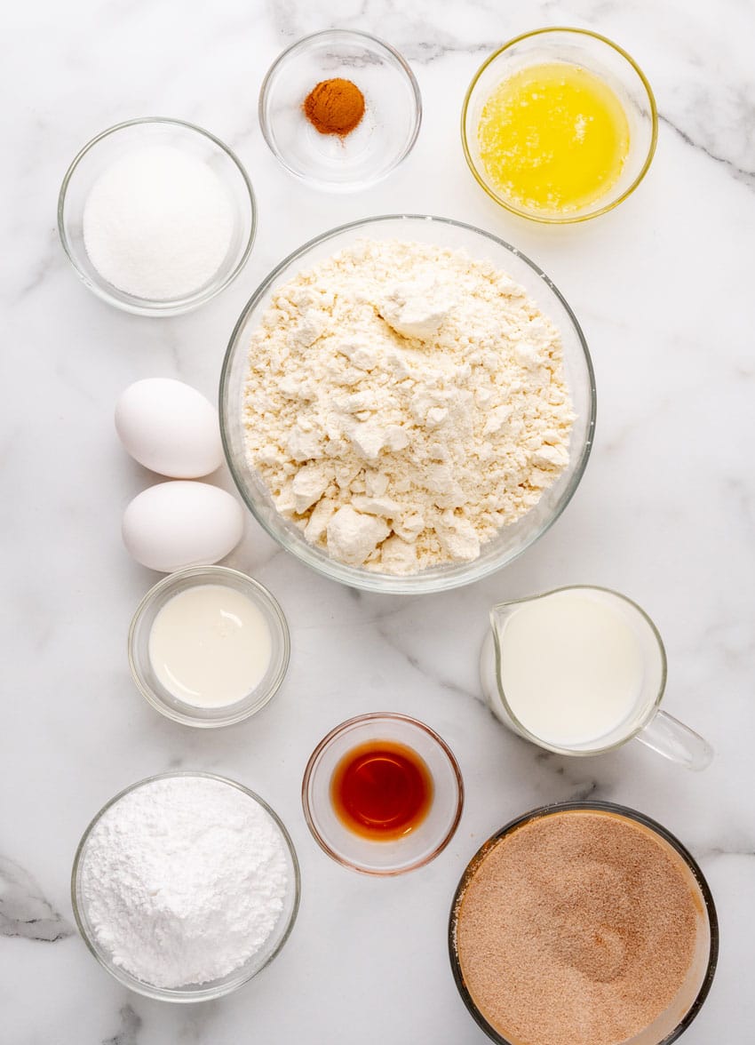 an overhead image showing the measured ingredients needed to make a copycat batch of Denny's pancake puppies
