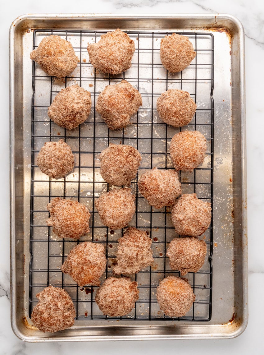 copycat denny's pancake puppies resting on a wire cooling rack