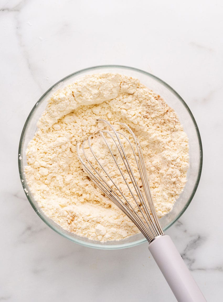 pancake puppy batter in a glass mixing bowl