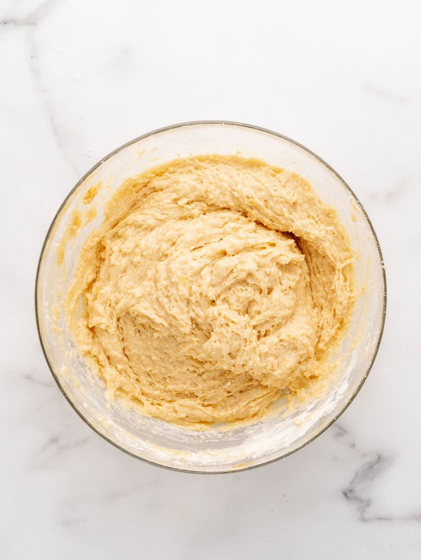 pancake puppy batter in a glass mixing bowl