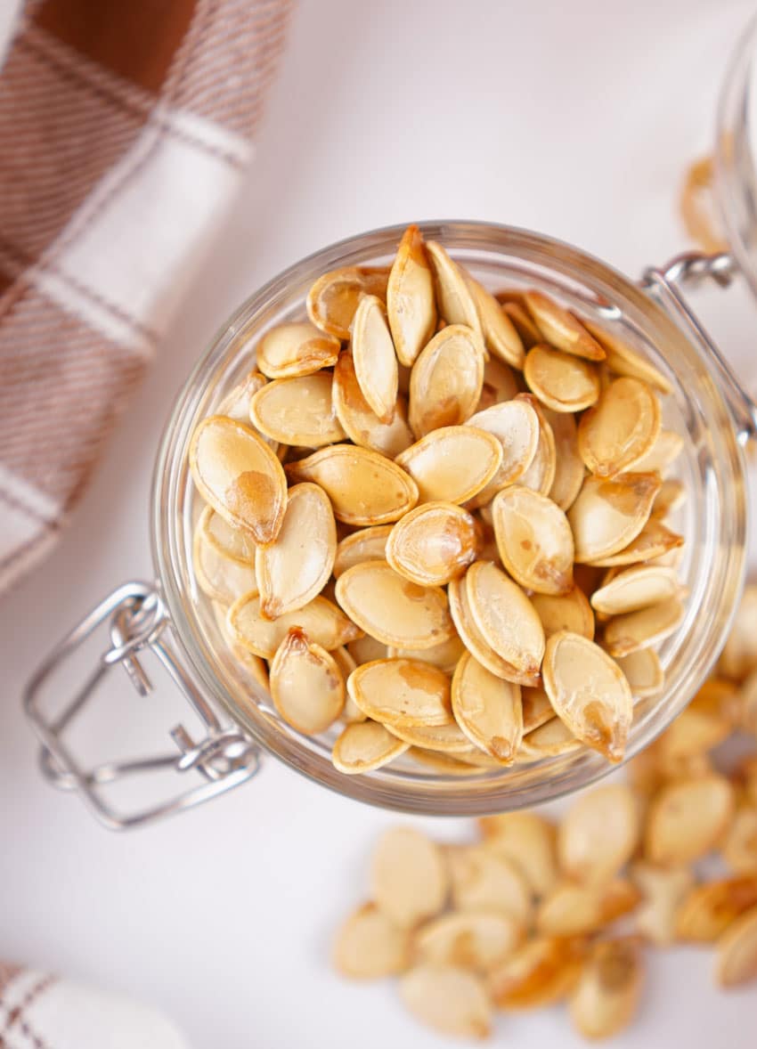 homemade roasted pumpkin seeds in a small glass jar
