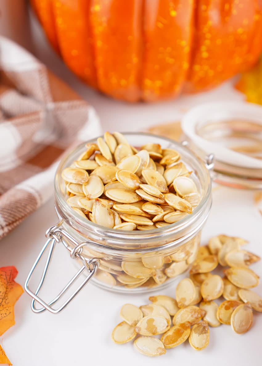 homemade roasted pumpkin seeds in a small glass jar