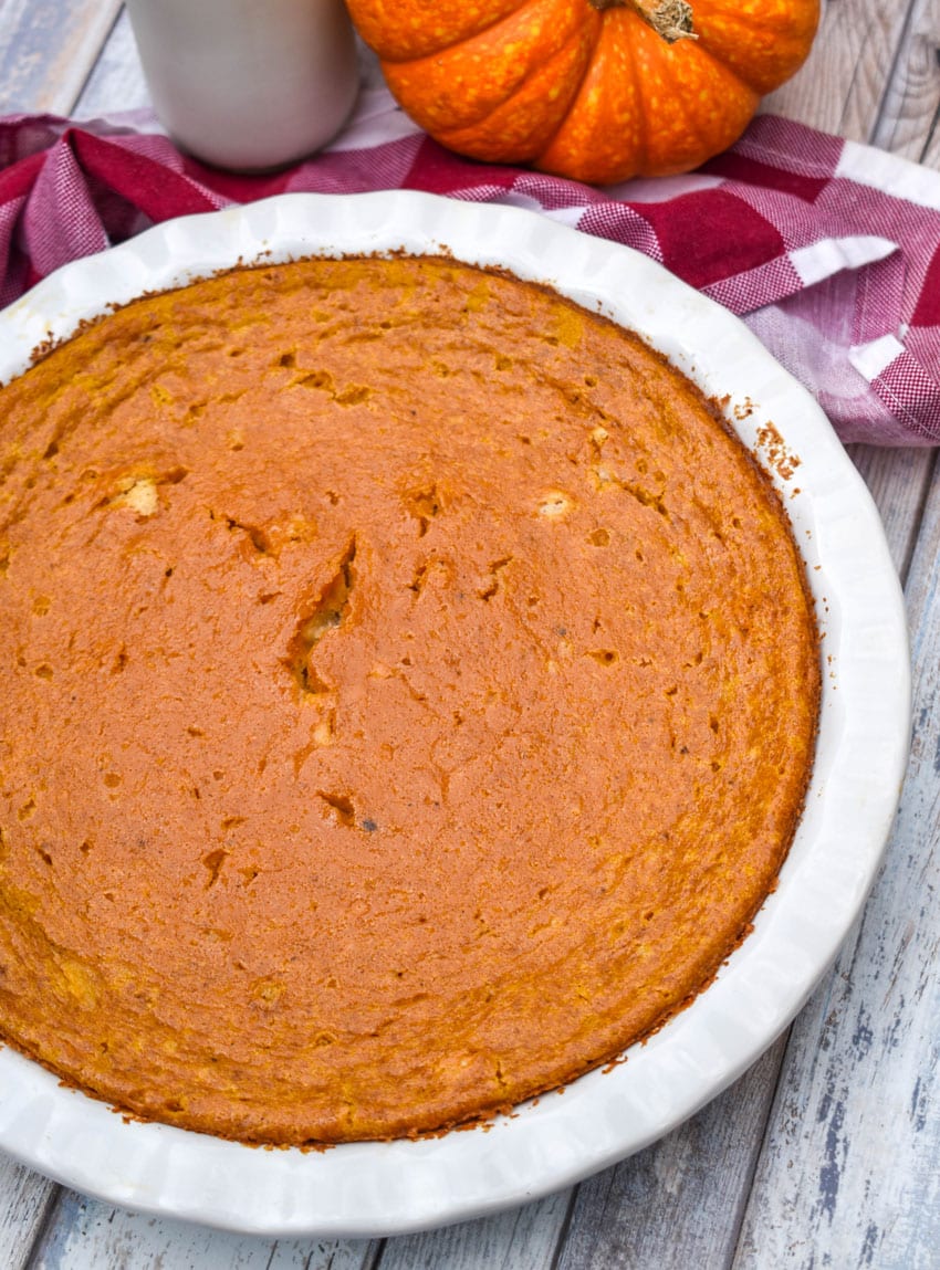 a crustless pumpkin pie in a white pie dish
