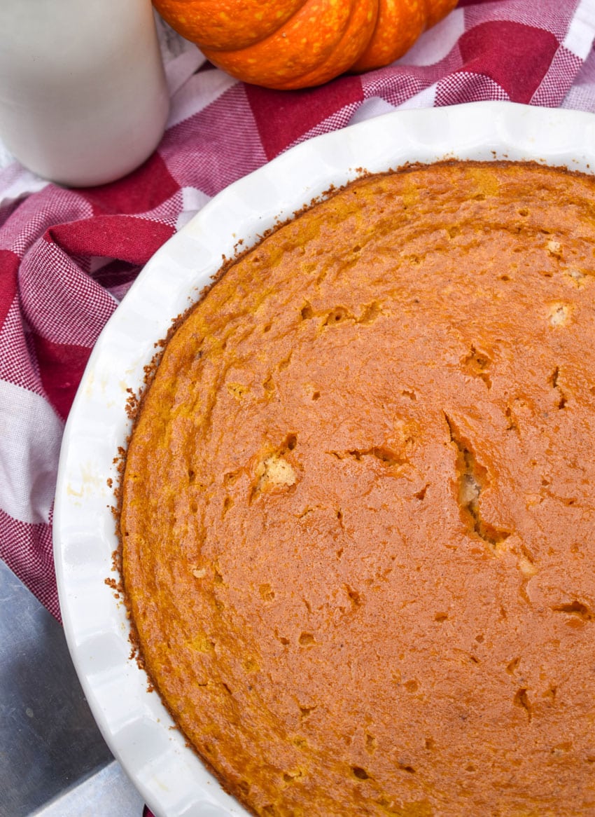 a baked impossible pumpkin pie in a white pie plate