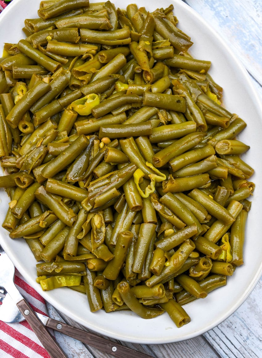 mississippi green beans on a white serving platter