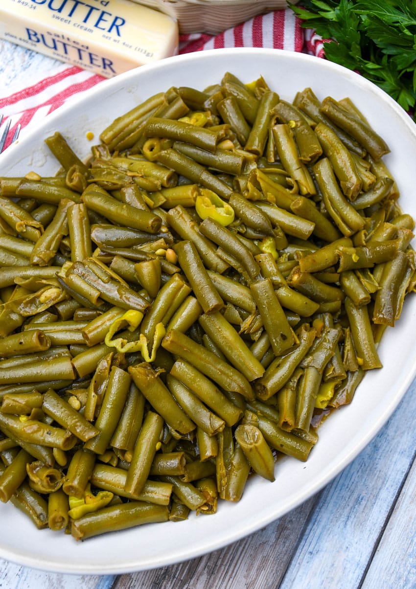 mississippi green beans on a white serving platter