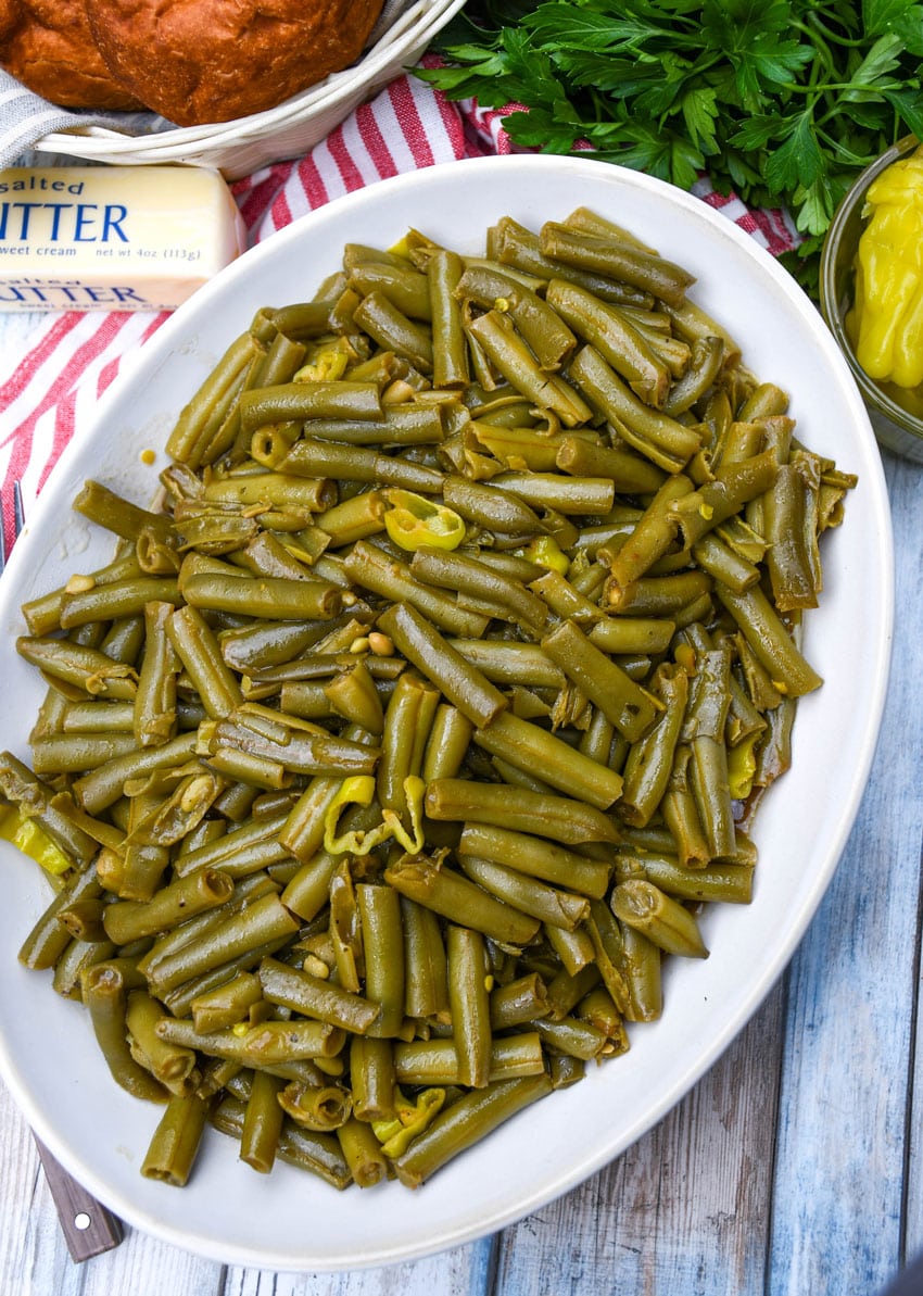 mississippi green beans on a white serving platter
