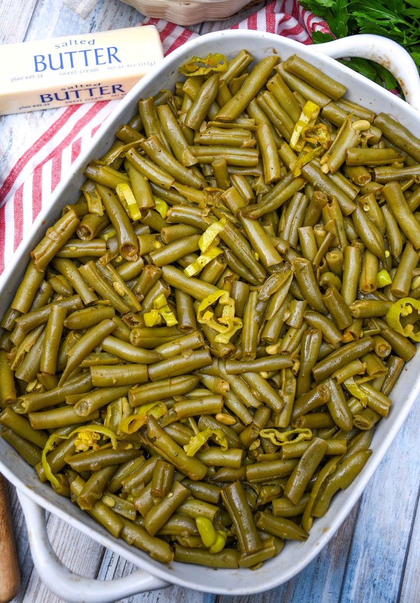 mississippi green beans in a white baking dish