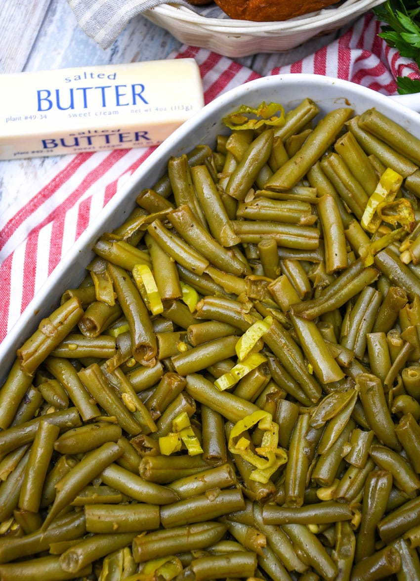 mississippi green beans in a white baking dish