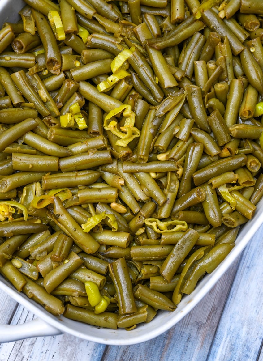 mississippi green beans in a white baking dish