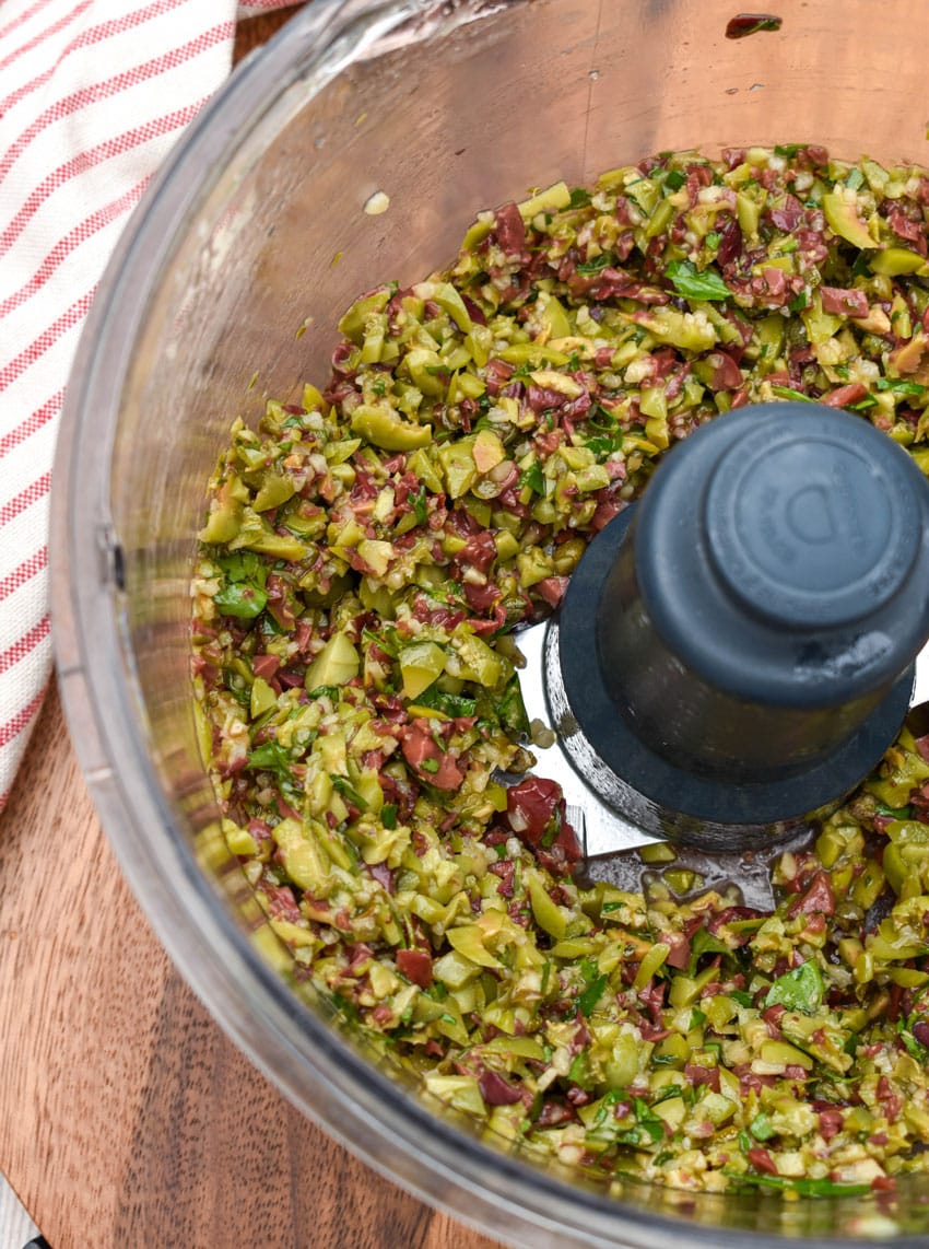 easy homemade olive tapenade in the bowl of a food processor