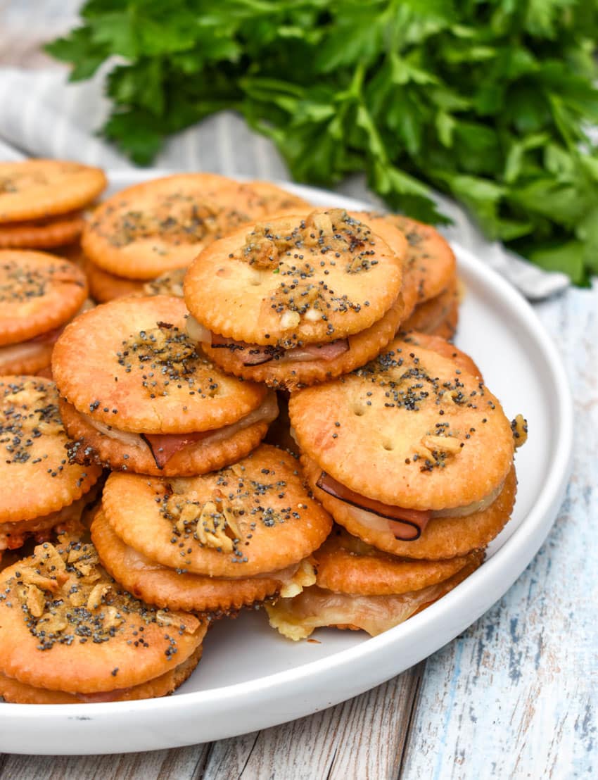 baked ritz cracker party sandwiches on a rimmed baking sheet