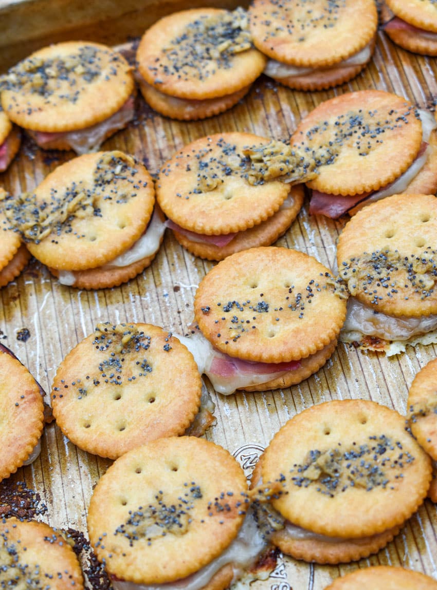 baked ritz cracker party sandwiches on a rimmed baking sheet
