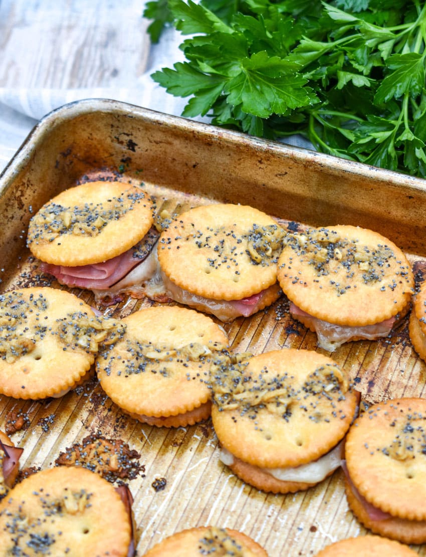 baked ritz cracker party sandwiches on a rimmed baking sheet