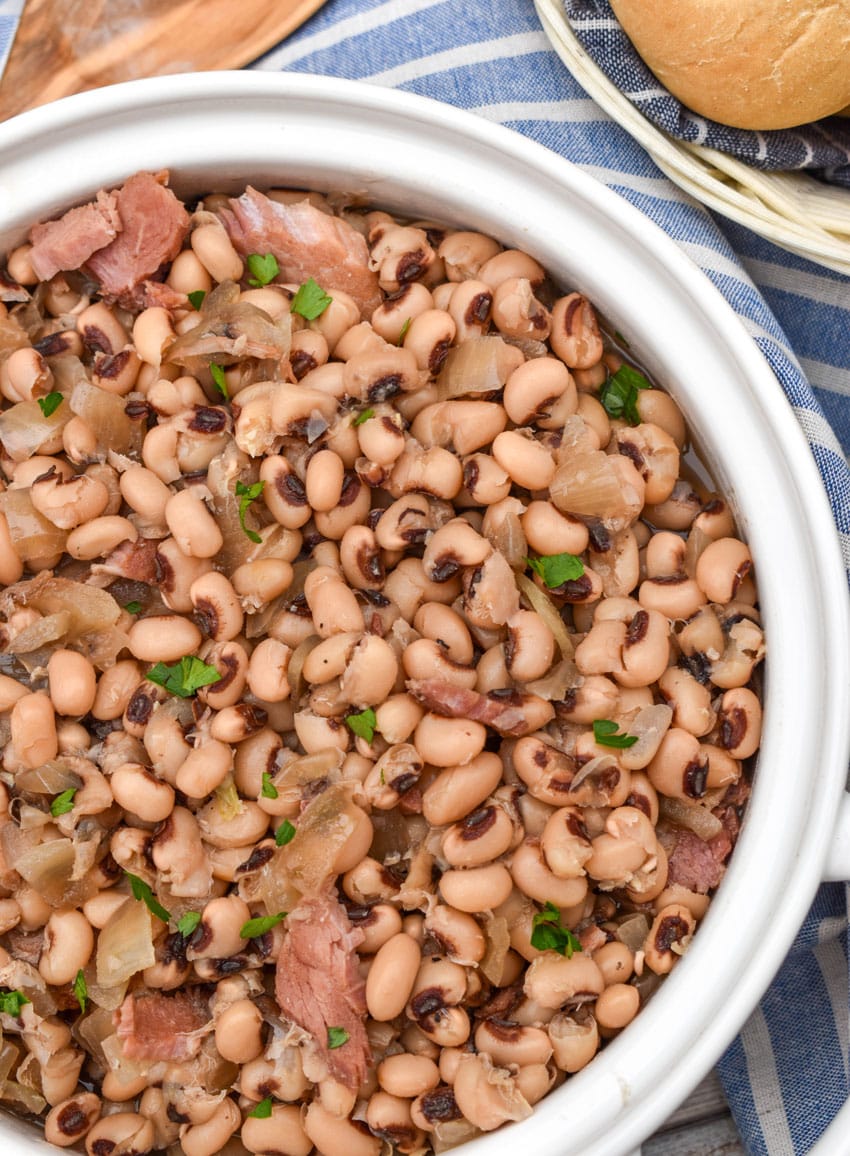 slow cooker black eyed peas in a white serving bowl