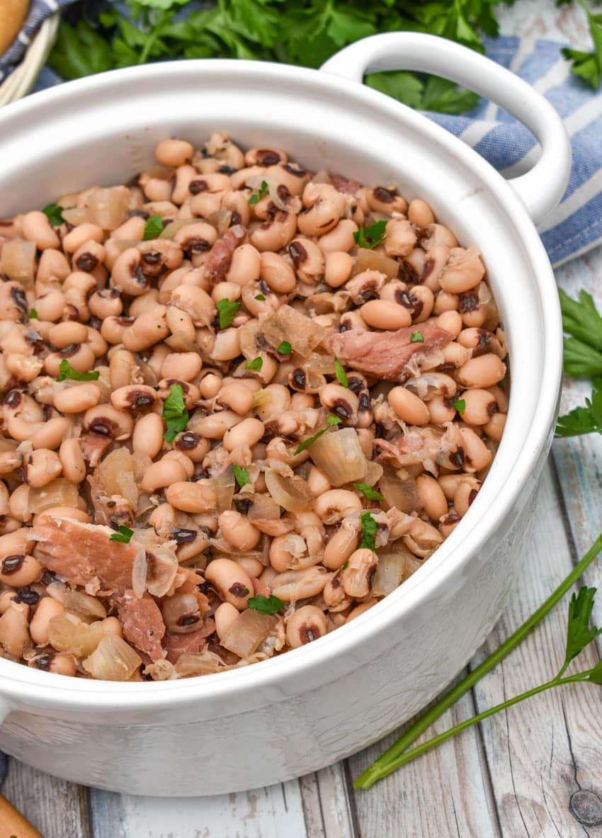 slow cooker black eyed peas in a white serving bowl
