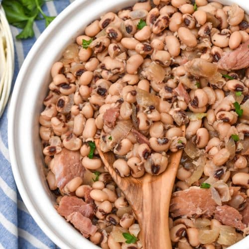 slow cooker black eyed peas in a white serving bowl