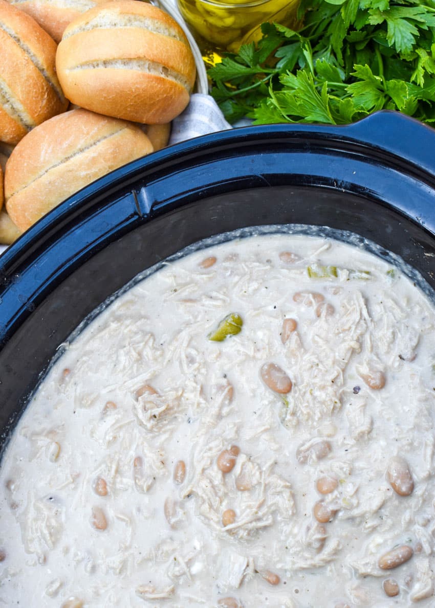 mississippi chicken chili in the black bowl of a slow cooker