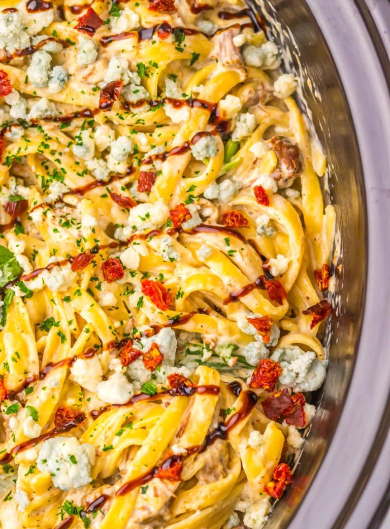 copycat steak gorgonzola pasta in the black bowl of a slow cooker